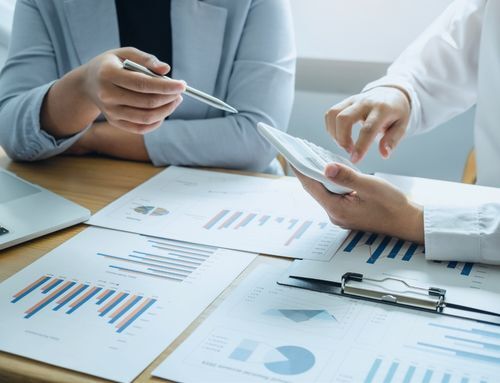 Data charts on a table, illustrating the strategic insights and planning provided by AI for negotiation and supply chain decision-making.