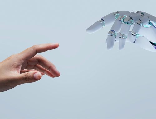 Close-up of a human hand and an AI robotic hand reaching out to connect, symbolizing collaboration between humans and artificial intelligence.
