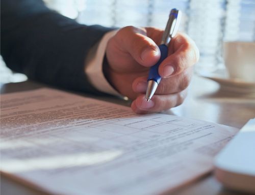 Professional reviewing a legal contract for compliance, representing Gysho’s commitment to risk management and policy alignment in procurement processes.