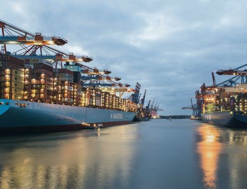 Photorealistic view of a busy shipping port with stacked containers, illustrating the scale and complexity managed by Gysho’s Self-Learning Autonomous Supply Chain AI solution.